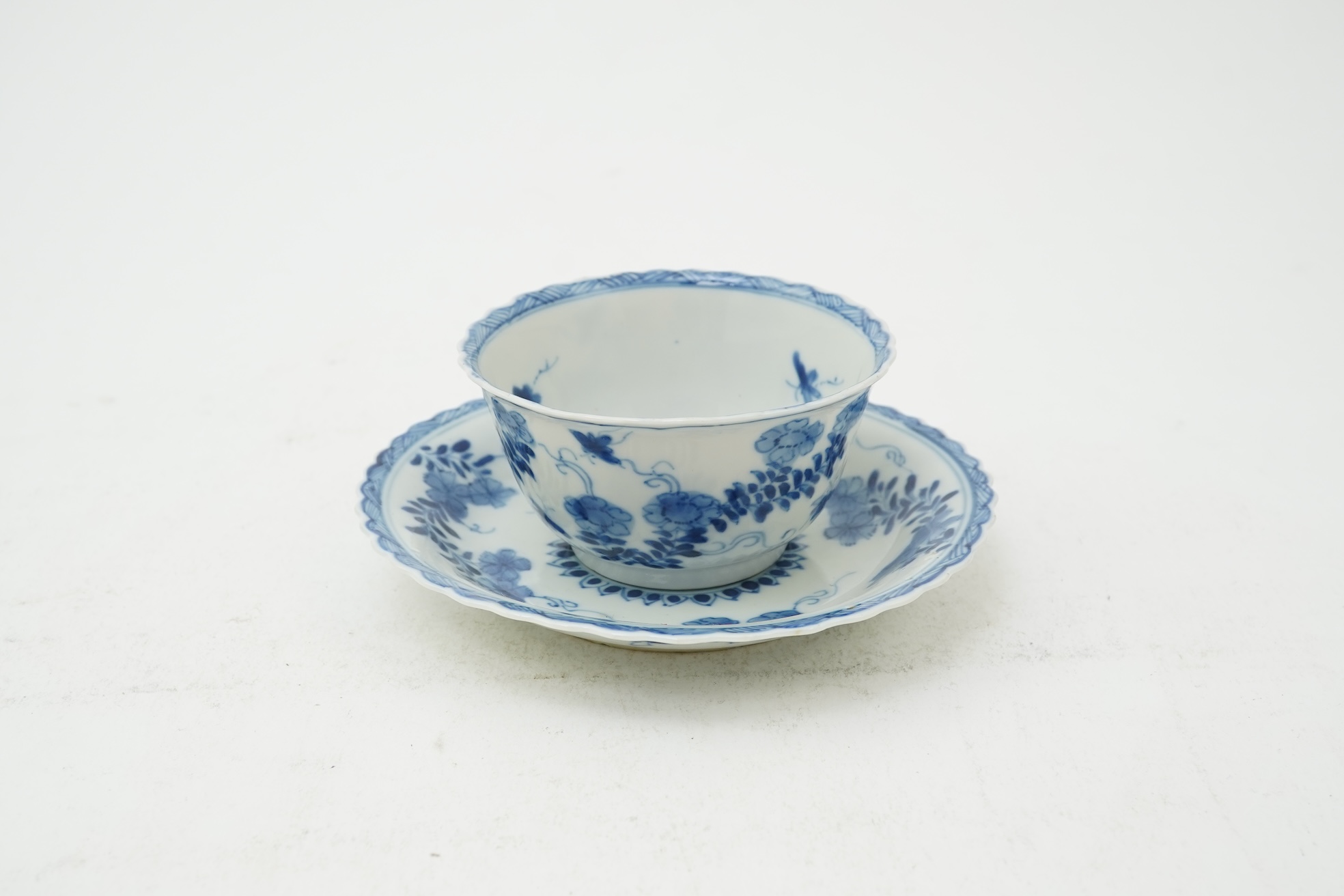 A Chinese blue and white tea bowl and saucer, Kangxi period
